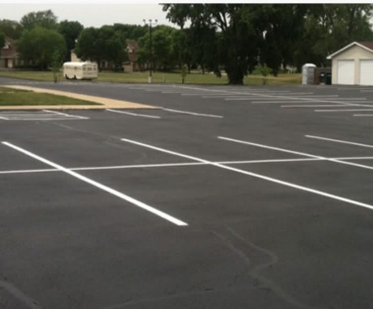 The same lot sealed black with crisp white stall lines