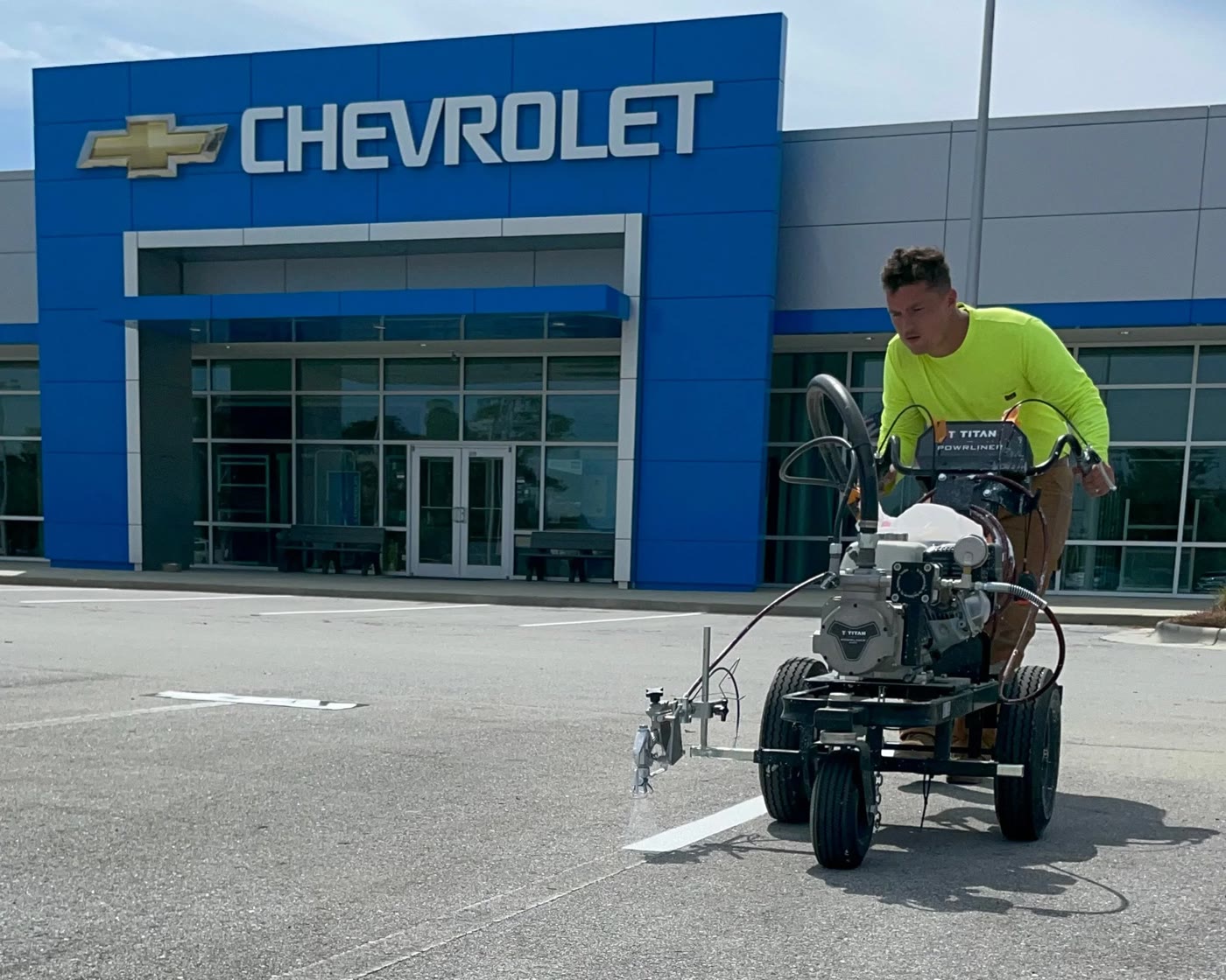 Billy striping a dealership lot