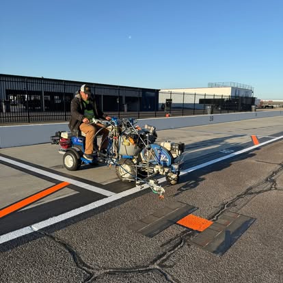 Our crew striping a race track pit lane